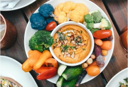 Platter of vegetables with a dip in the middle