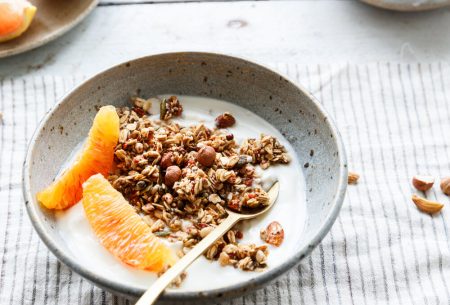 Bowl of yogurt, granola and orange segments