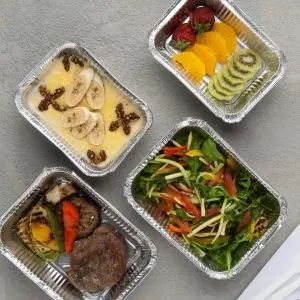 A photo of a takeaway with healthy toppings on top like banana and nuts