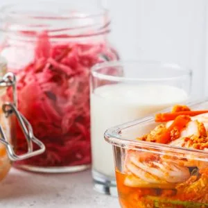 A photo of fermented cabbage and fermented dairy in jars