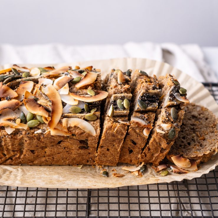 A photo of the banana, fig & courgette loaf, sliced and placed on the table