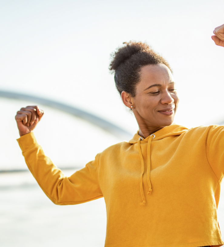 Photo of a women showing strength to demonstrate resilience via workplace wellbeing