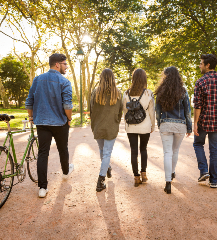 Photo of a group walking in a park to show workplace wellbeing