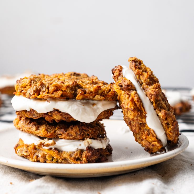 A photo of three of the carrot cookies of a plate