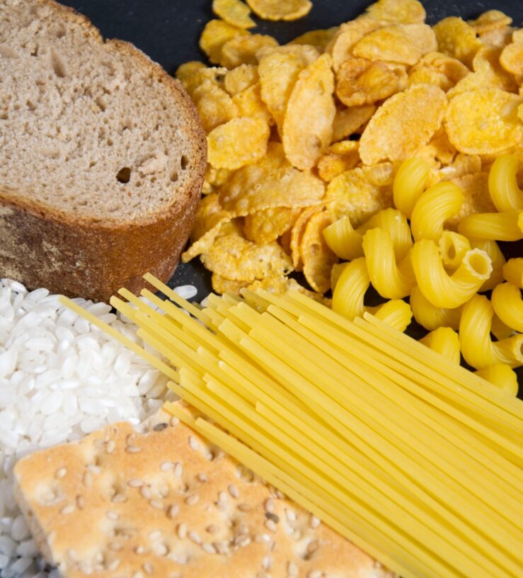 A photo of pasta, bread, cornflakes, rice and crackers