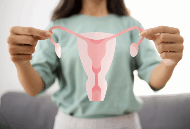 Dr Megan Rossi in a lab looking through a microscope